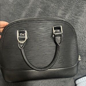 Black purse brand new.  Has straps and dust bag